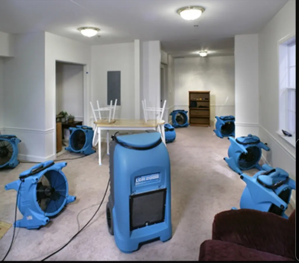 Air movers and dehumidifier setup for Water Damage Restoration in Denison